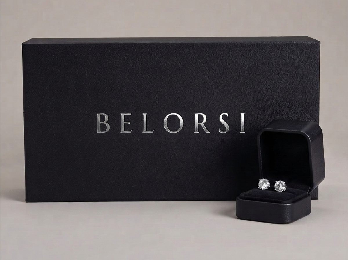 A Belorsi presentation box with a pair of lab diamond studs in an open case beside it