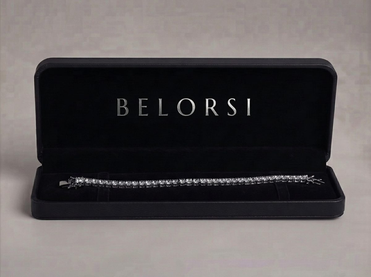 An open Belorsi presentation case with a lab diamond tennis bracelet inside